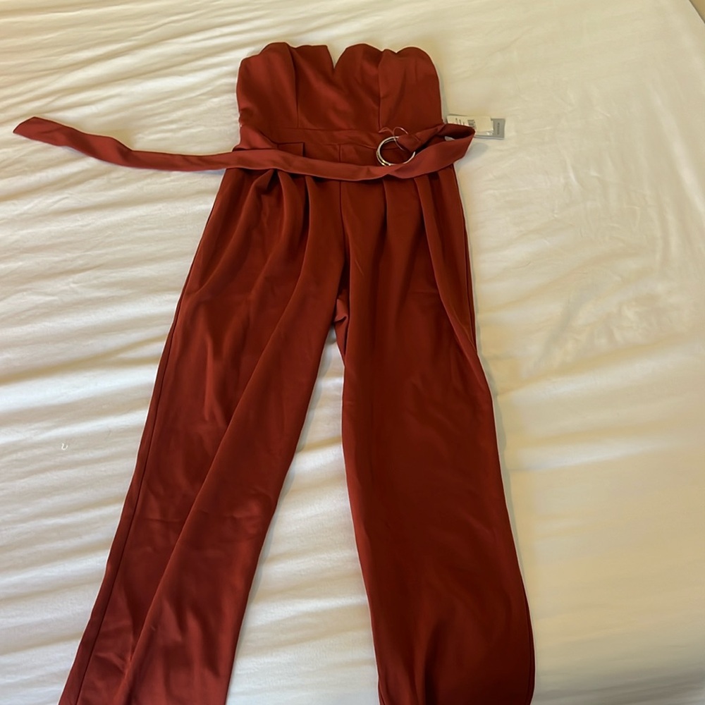 Burnt orange jumpsuit.
